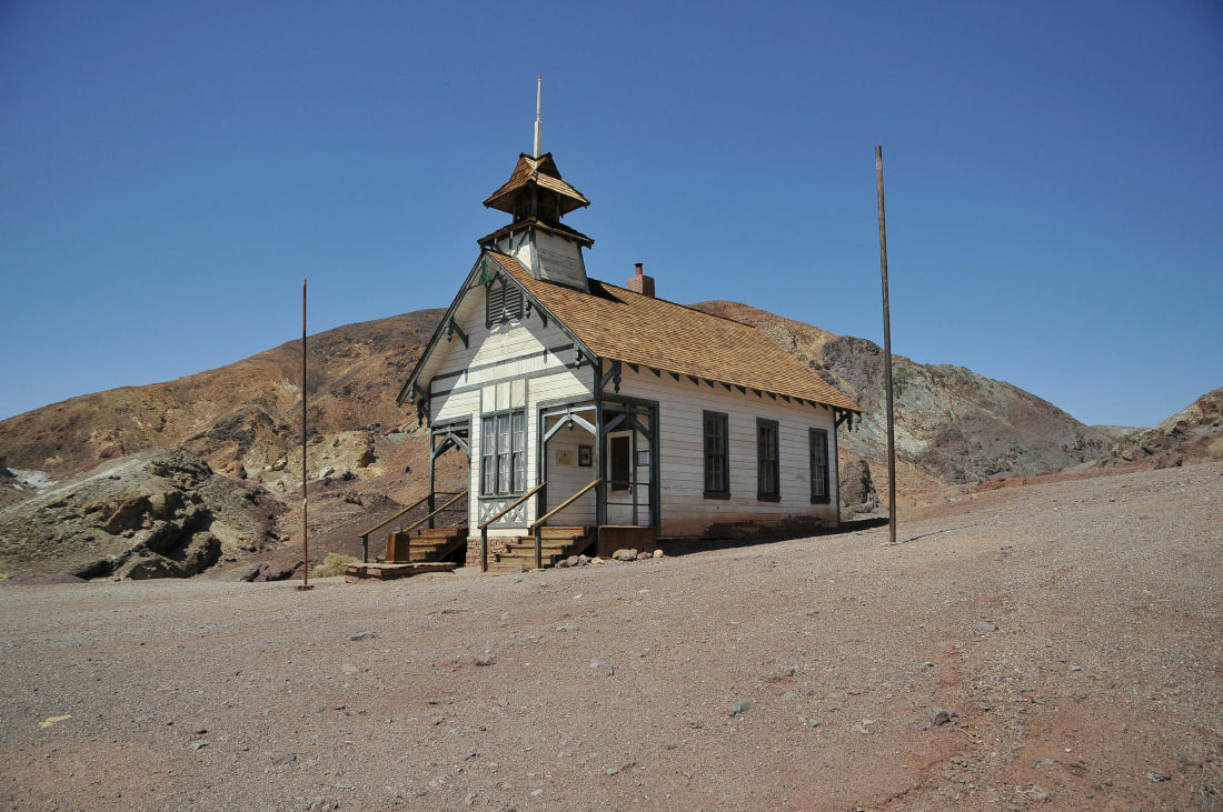 An eerie looking image of an abandoned schoolhouse in California