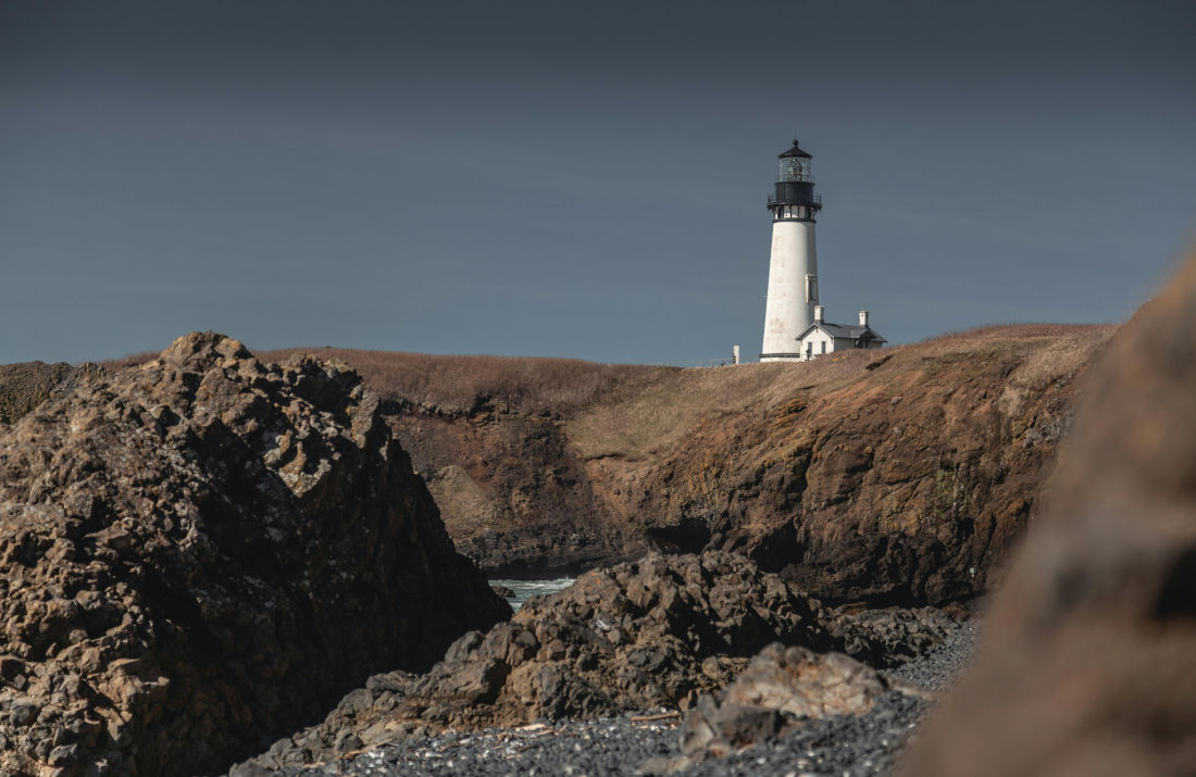 An eerie looking white lighthouse located in Oregon